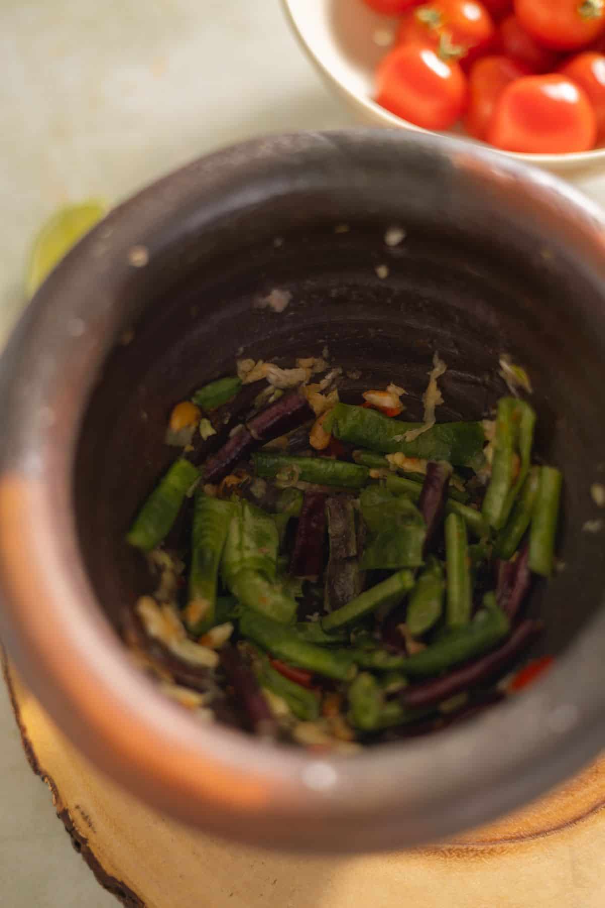 Pound long beans and roasted peanuts