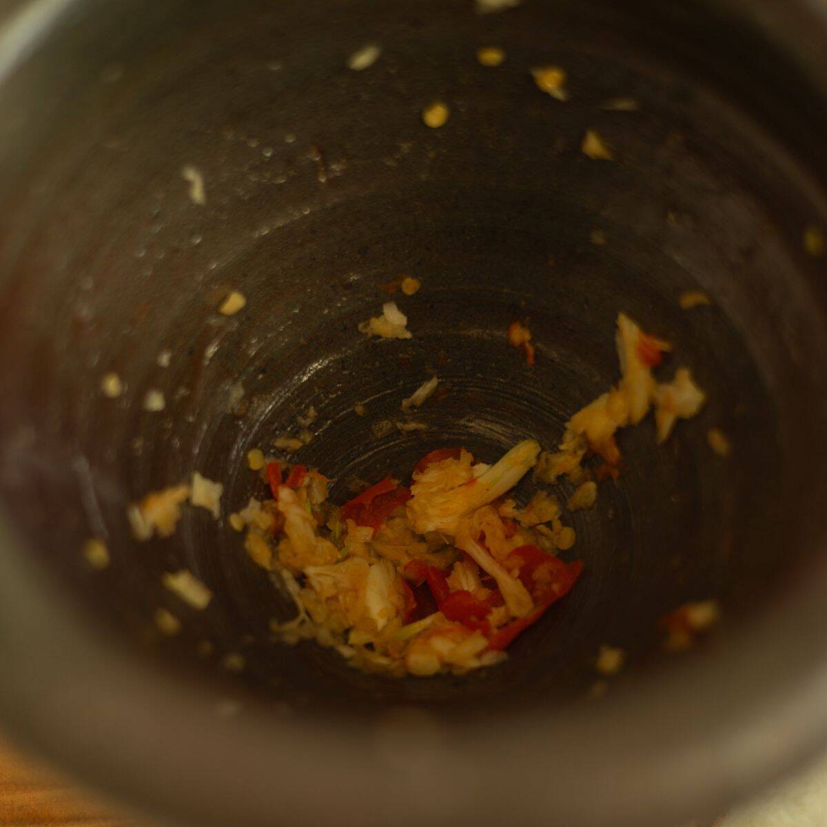 pound garlic and Thai chilies